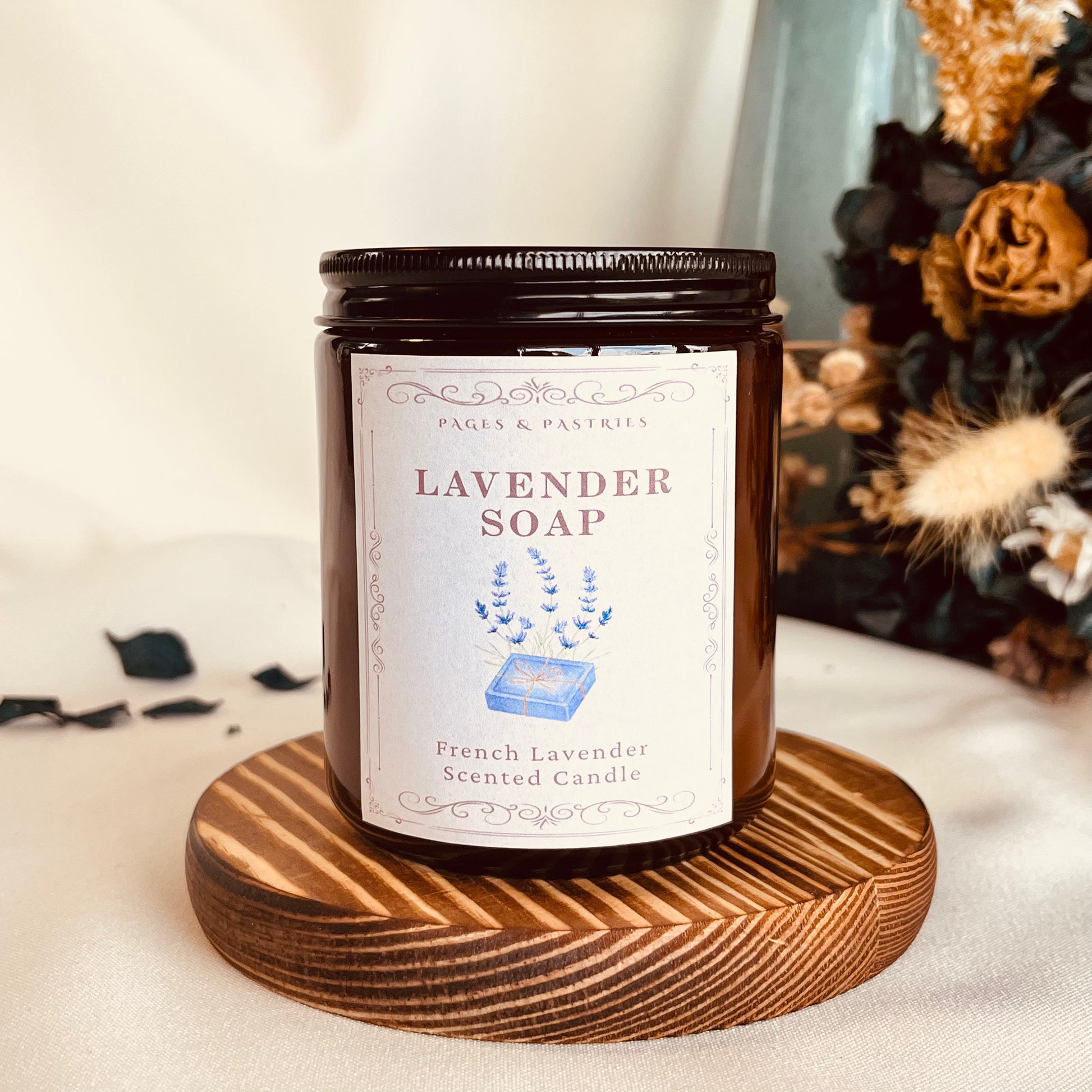Lavender Soap bookish candle in amber glass jar with lavender scent, showing soap bar and lavender sprigs on label